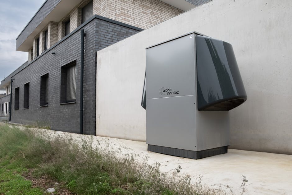 Heat pump installer working on a UK home installation