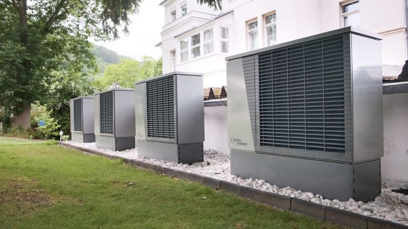 Heat pump outdoor unit in a garden