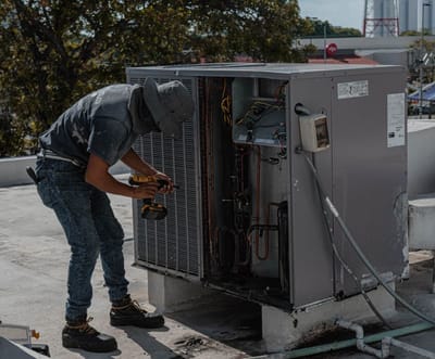 Heating engineer working with tools