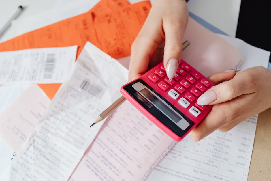 UK household energy bill and calculator on a desk illustrating heating cost comparison